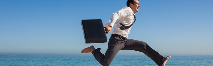 Businessman jumping with joy