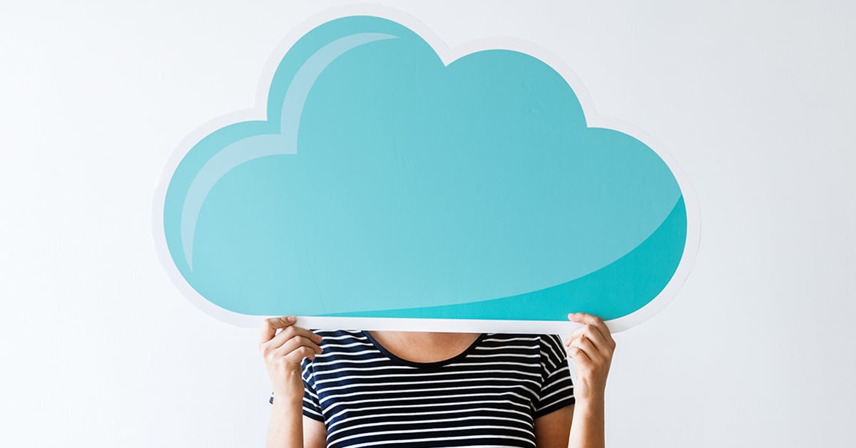 Person Holding a Cutout of a Cloud