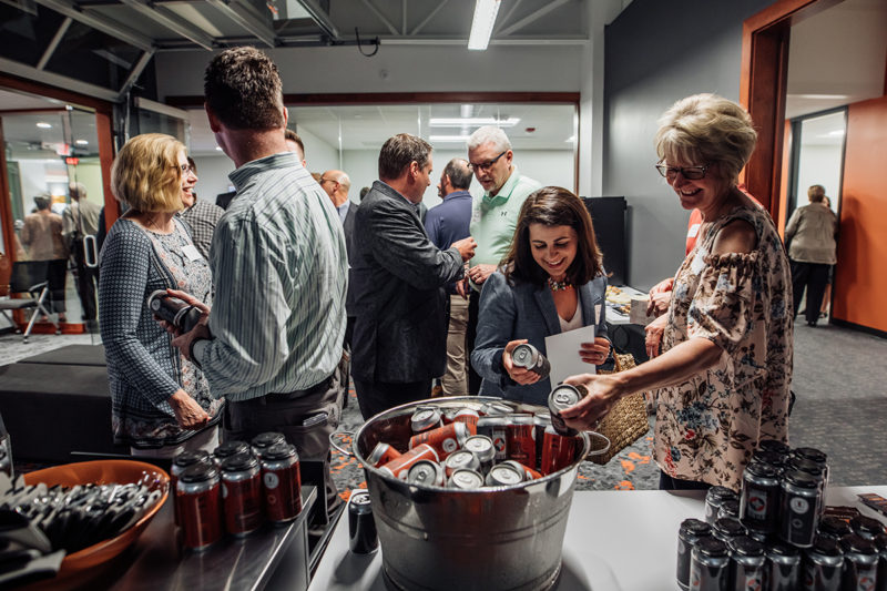 Chortek Summer 2019 Open House - guests enjoying our branded beer detail