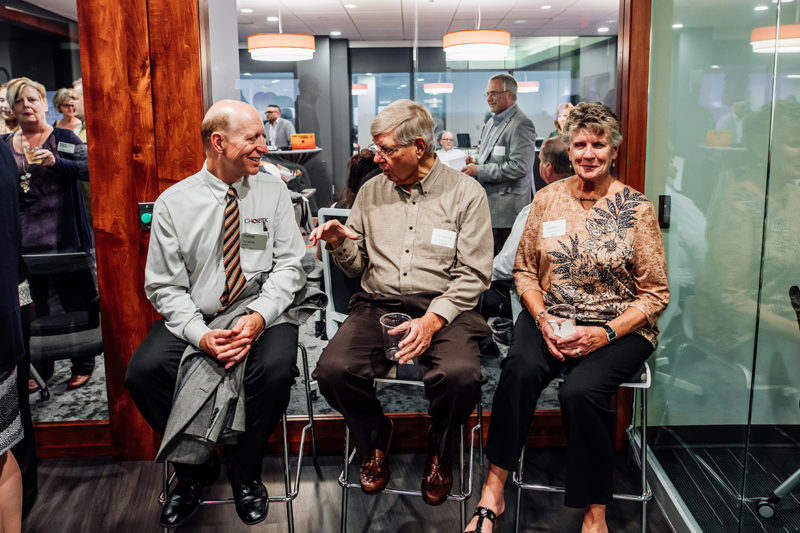 Chortek Summer 2019 Open House - guests sitting with Pat Wirth