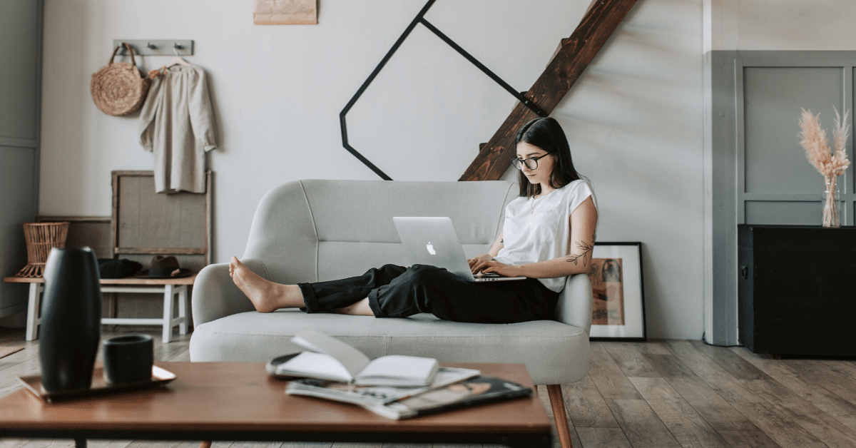 SEP IRA and 401(k) - Should I contribute to both? - picture of a woman using a laptop on a couch