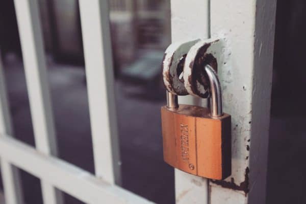 How to Keep Your Zoom Calls Secure - Image of a padlock securing a gate